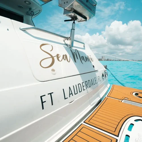 Close-up of Sea Mami yacht name detail on the hull.