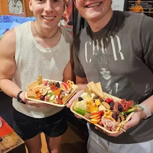 2-guys-holding-cheese-boards