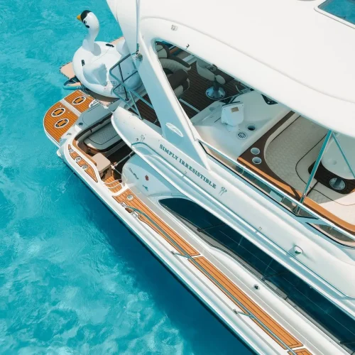 Aerial view of yacht teak swim platform and stern with swan float.