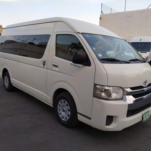 White Toyota HiAce passenger van used for shared transfers