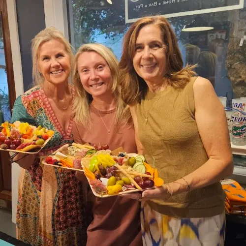 group-of-3-ladies-holding-their-cheese-boards