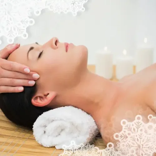 Peaceful brunette enjoying a facial massage