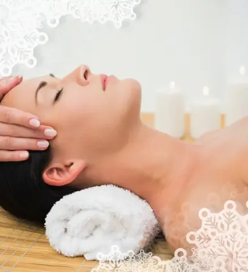 Peaceful brunette enjoying a facial massage