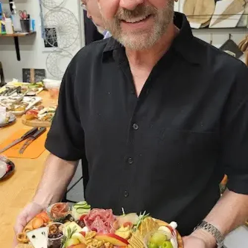 man-holding-Cheese-board